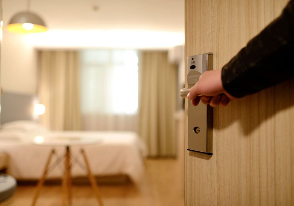 pexels-photo-271639 Person Holding on Door Lever Inside Room